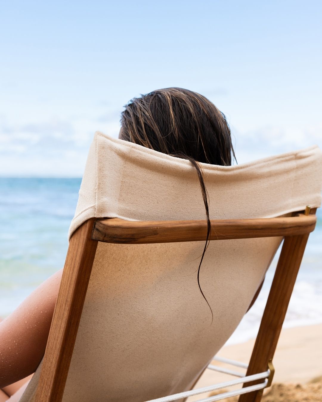 Person sitting on a Shorebird Chair with a view of the ocean