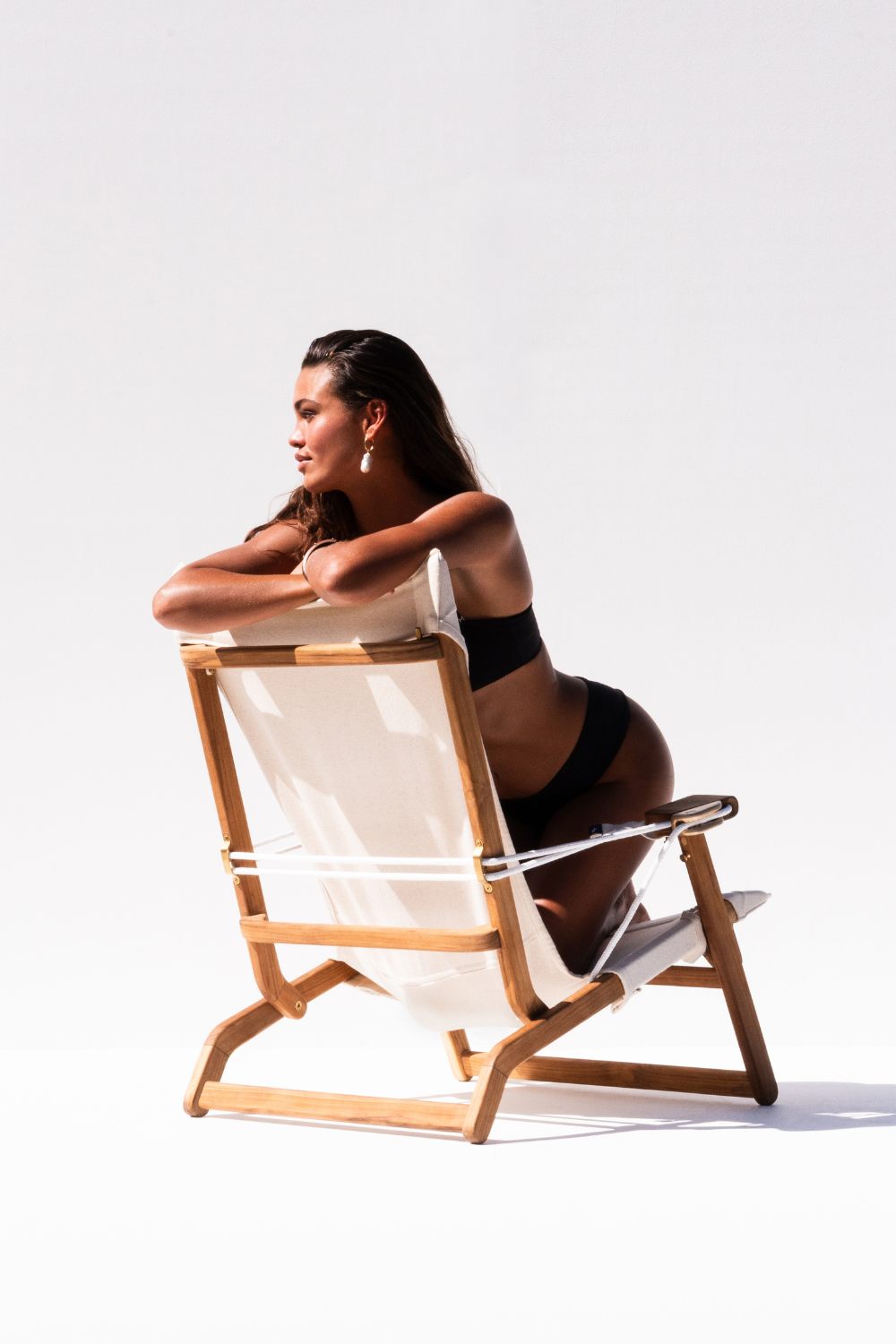 Woman sitting on Shorebird Beach Chair