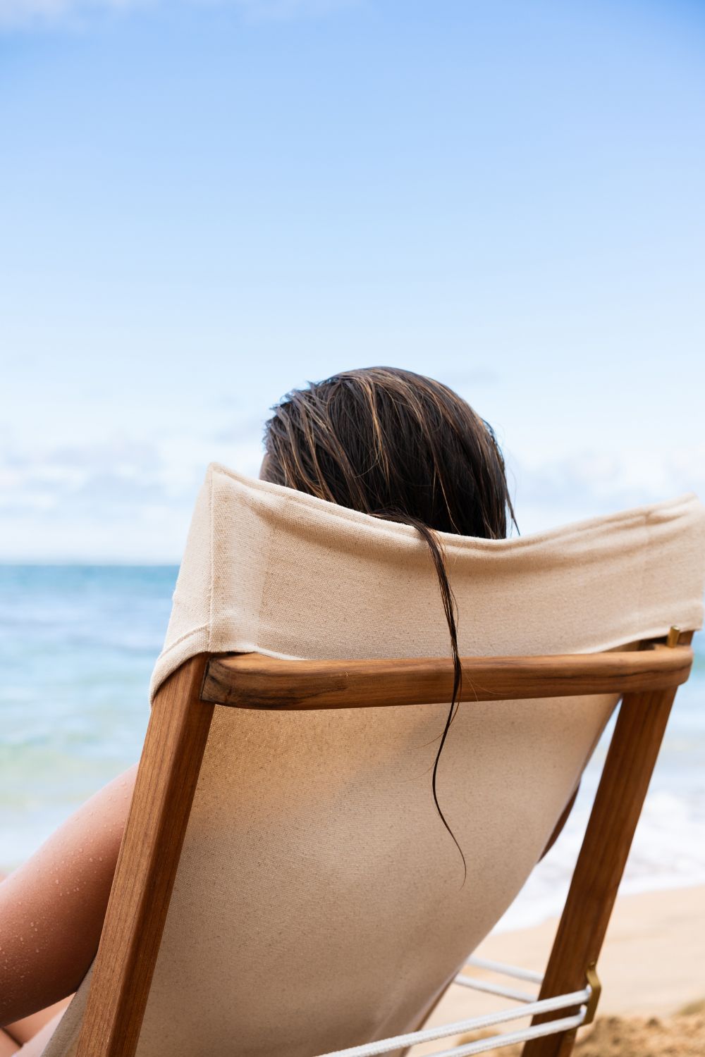 Woman sitting in Shorebird Beach Chair