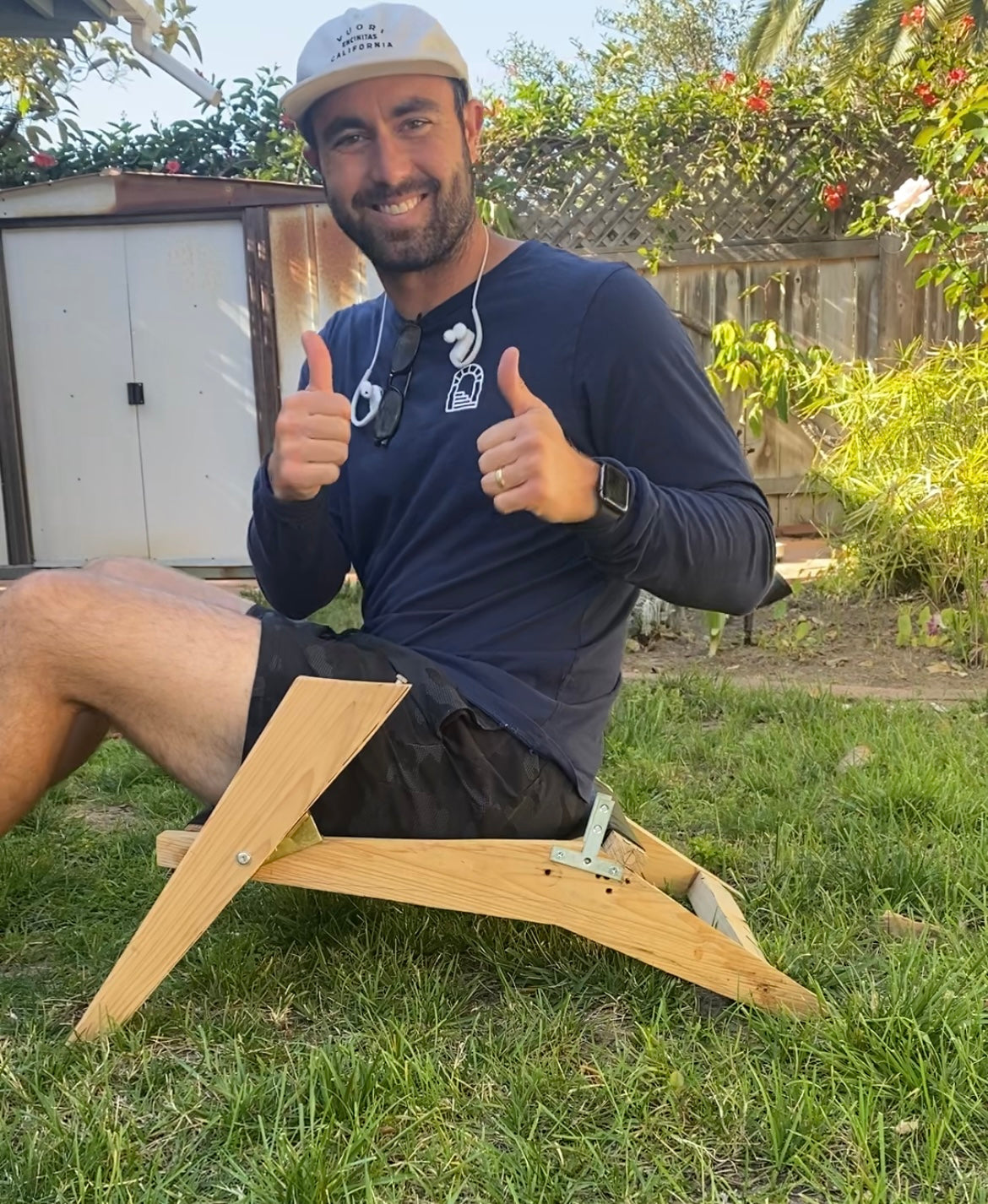 Shorebird founder Taylor Patton sitting in an early prototype of the Shorebird Beach Chair