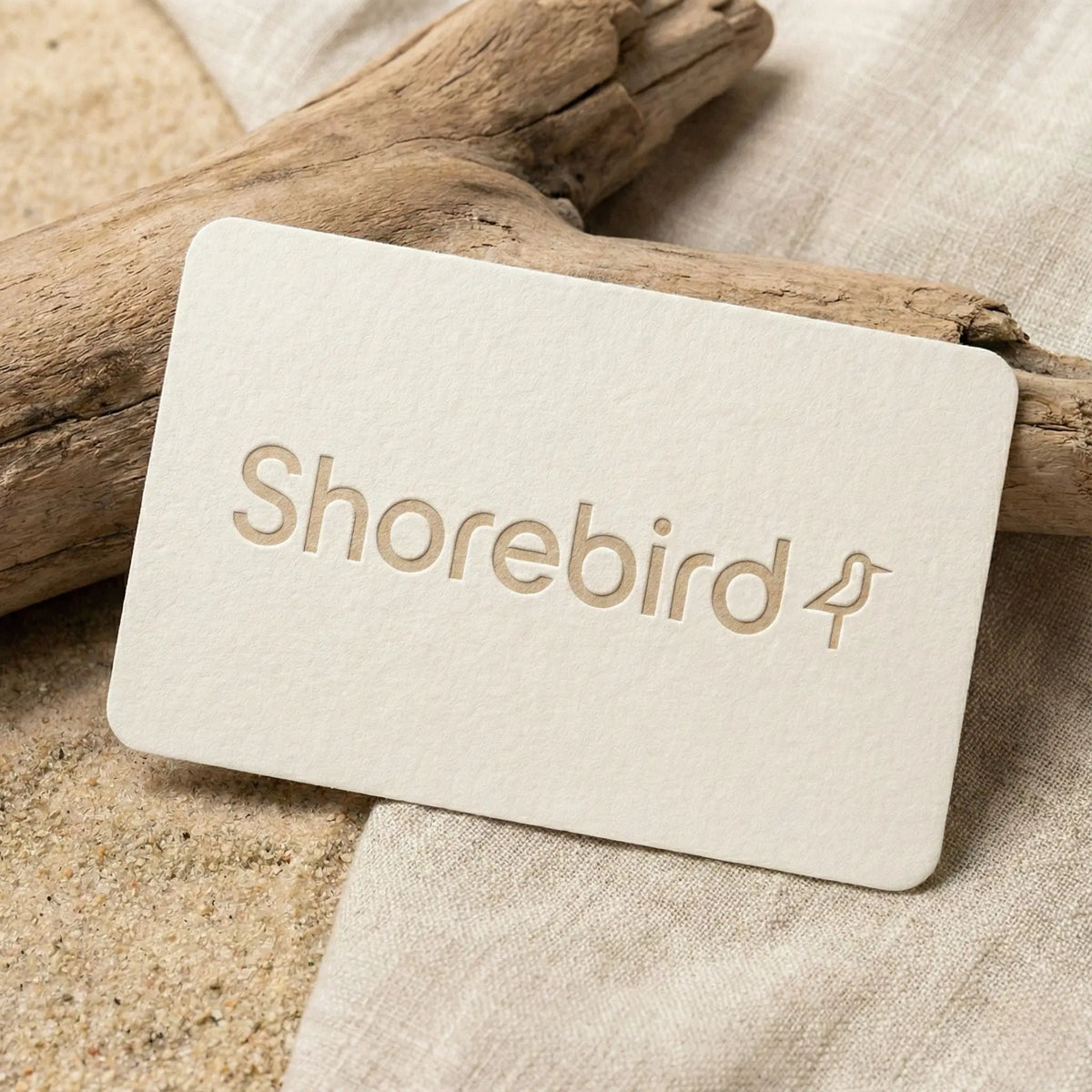 Shorebird digital gift card with letterpress logo on driftwood and linen